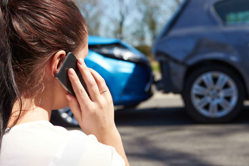 (woman calling on phone after an accident)